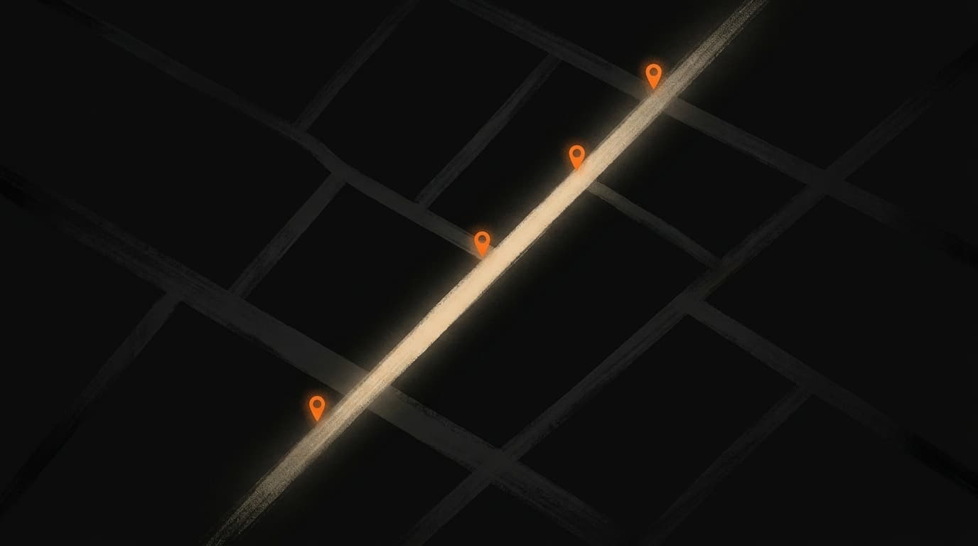 A single lit path through a dark grid with orange waypoints marking four stages. All other paths are dark.